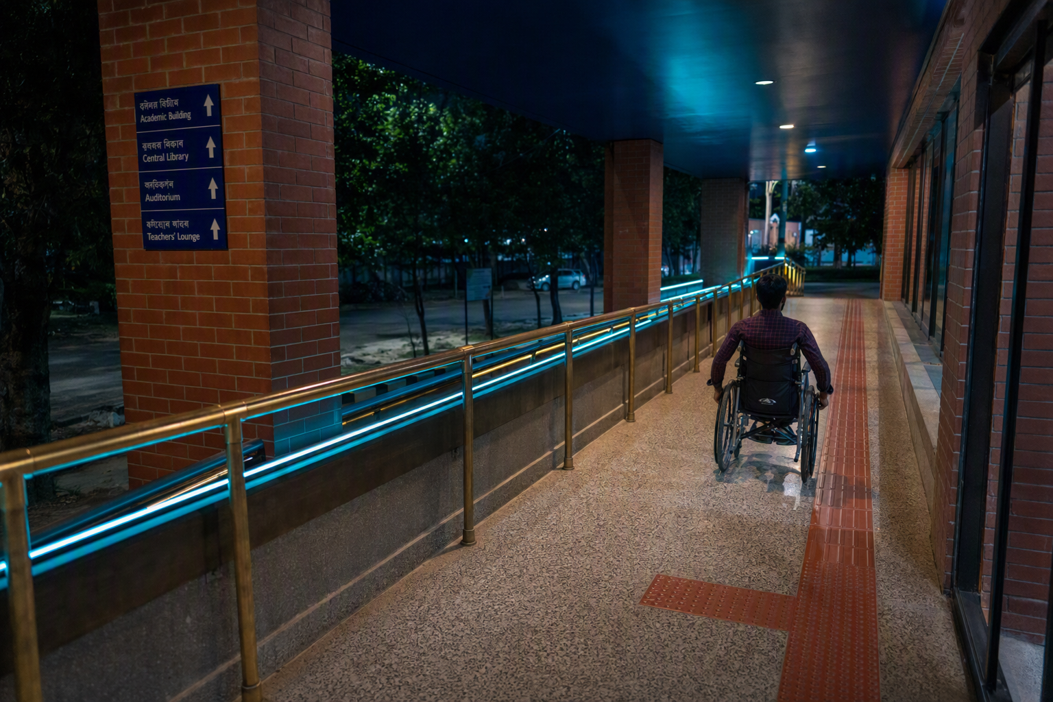 A broad step-free gallery route with gentle ramps, clear floor markings, and space for two wheelchair users to pass