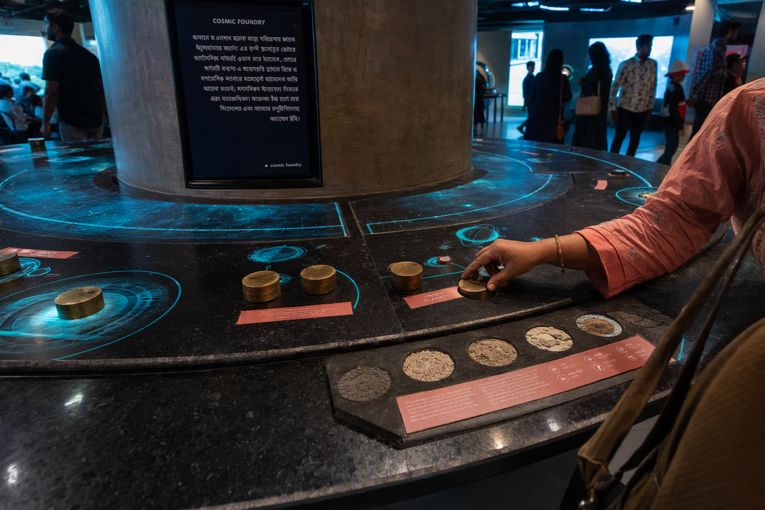 A child and adult guiding arcs of light across the circular Cosmic Foundry installation