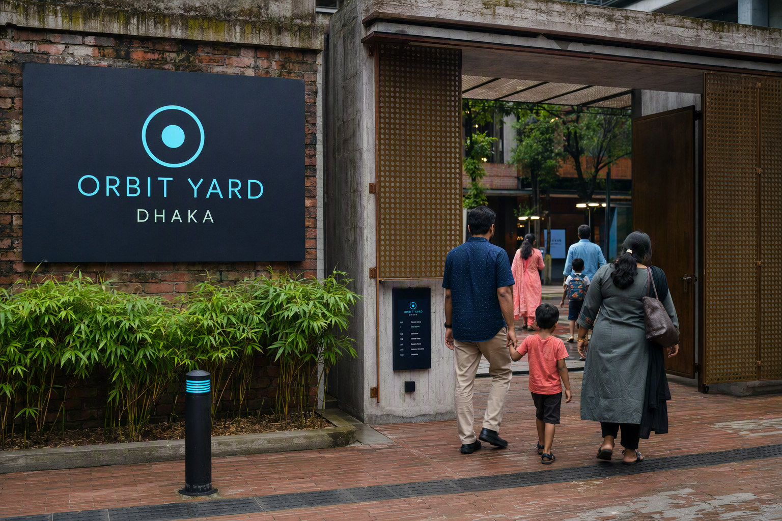 Visitors approaching Orbit Yard's shaded brick and bamboo entrance beneath a cyan wayfinding canopy